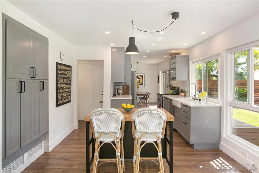 13637 Calais Drive Del Mar, CA 92014 - Photo 10 of 25 a dining room with stainless steel appliances granite countertop furniture and a kitchen view