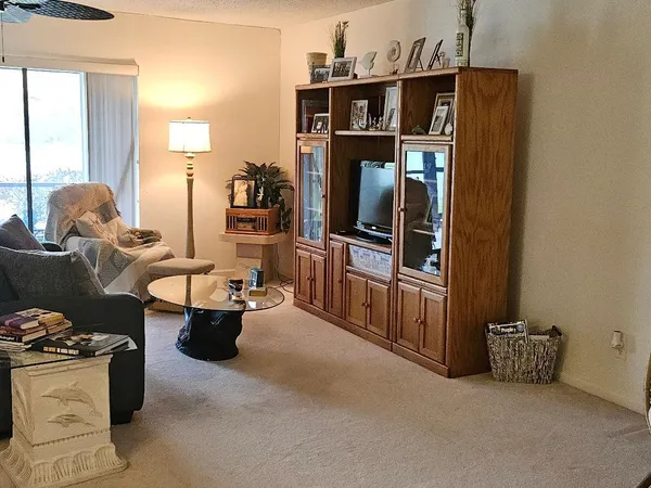 a bed room with a bed and a chair