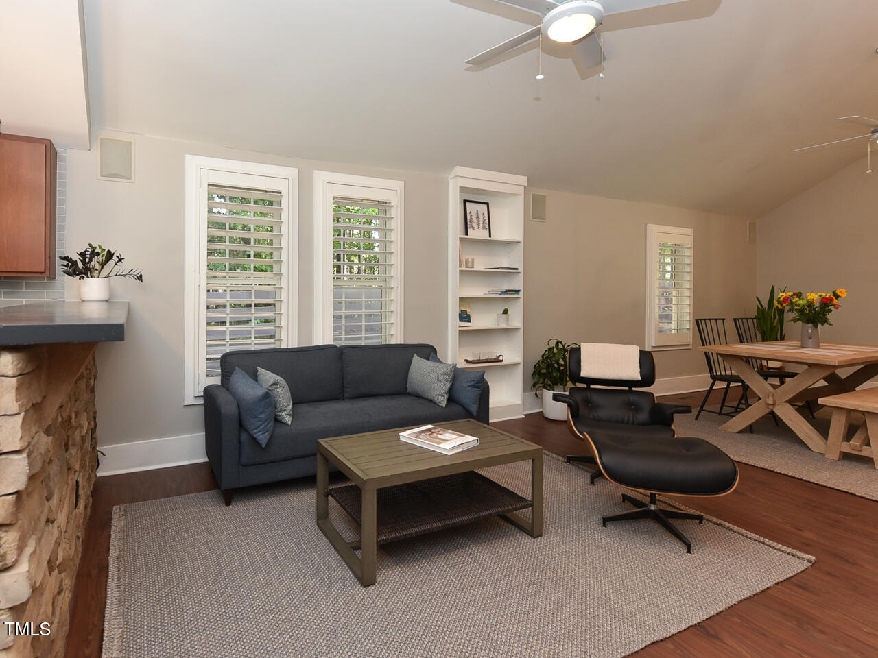 3223 Tryon Road Raleigh, NC 27603 - Photo 19 of 45 a living room with furniture and a fireplace