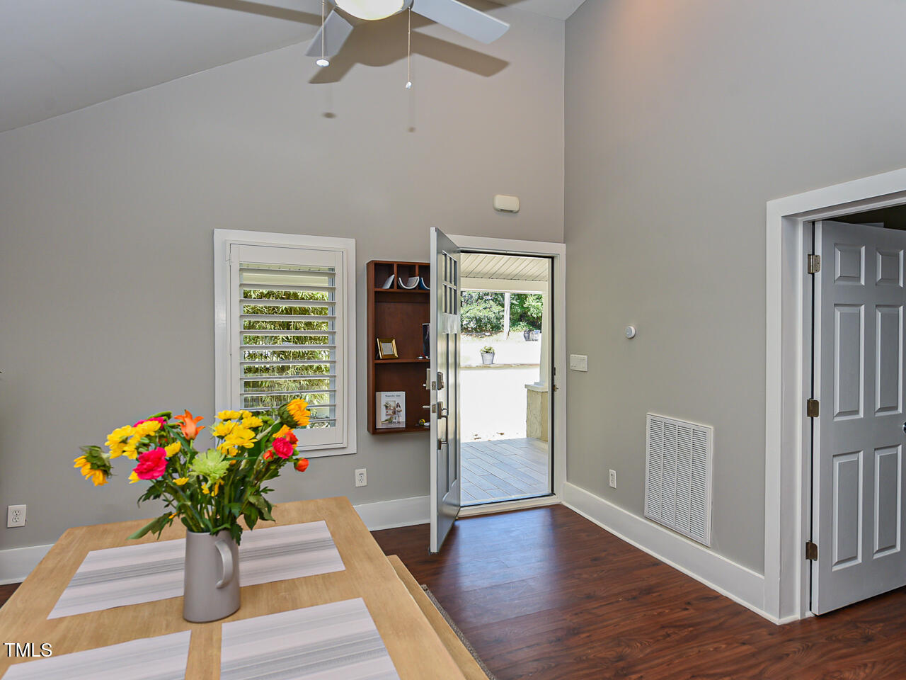 3223 Tryon Road Raleigh, NC 27603 - Photo 21 of 45 a flowers room with wooden floor and a chandelier