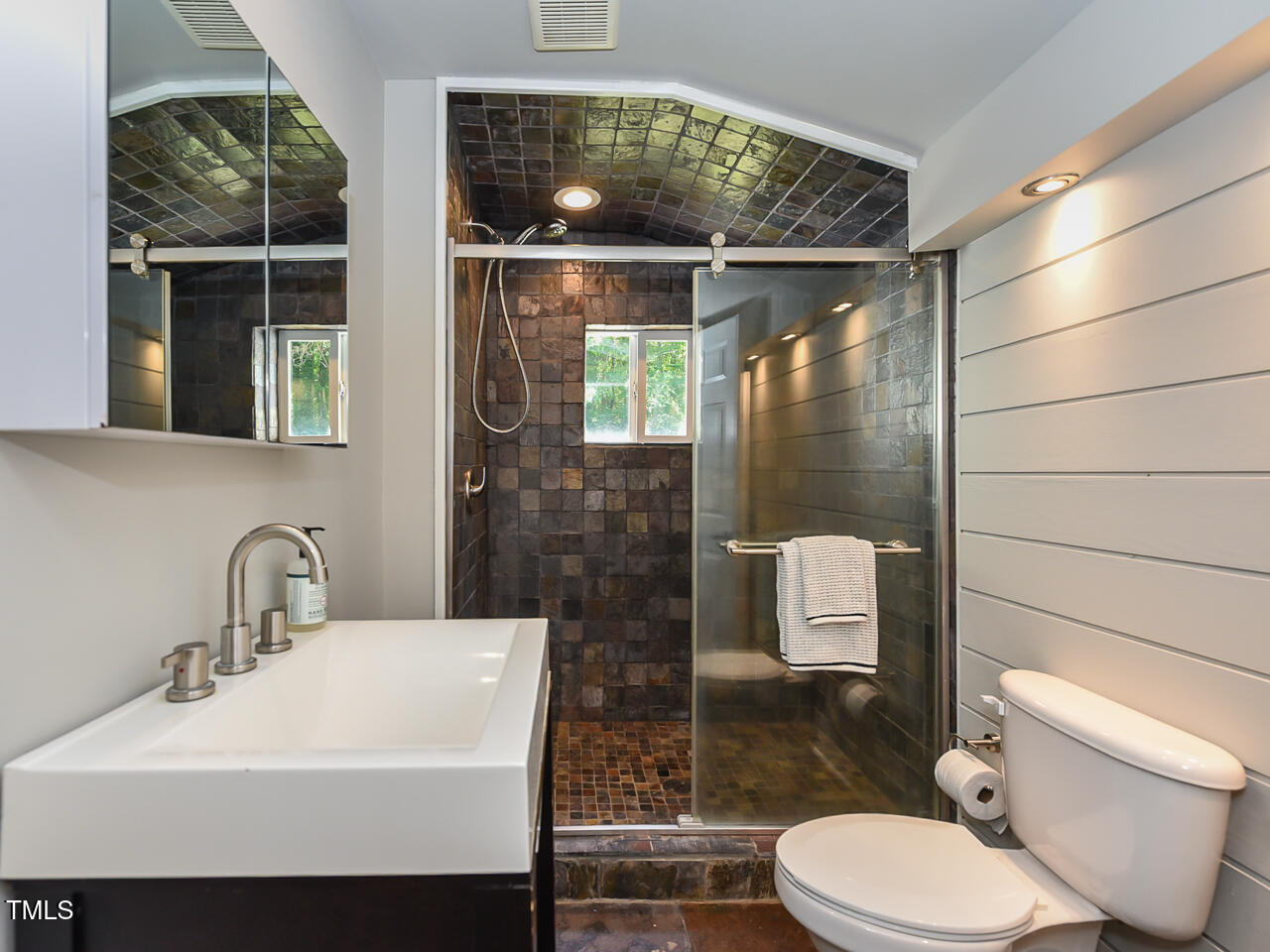 3223 Tryon Road Raleigh, NC 27603 - Photo 26 of 45 a bathroom with a sink toilet and shower