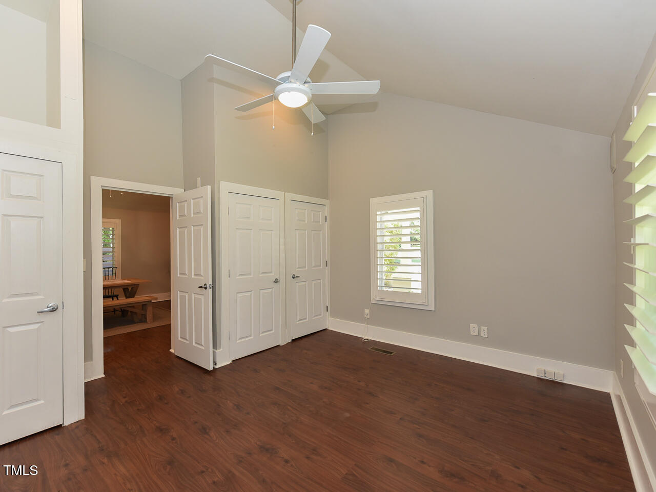 3223 Tryon Road Raleigh, NC 27603 - Photo 28 of 45 a view of an empty room with wooden floor and a window