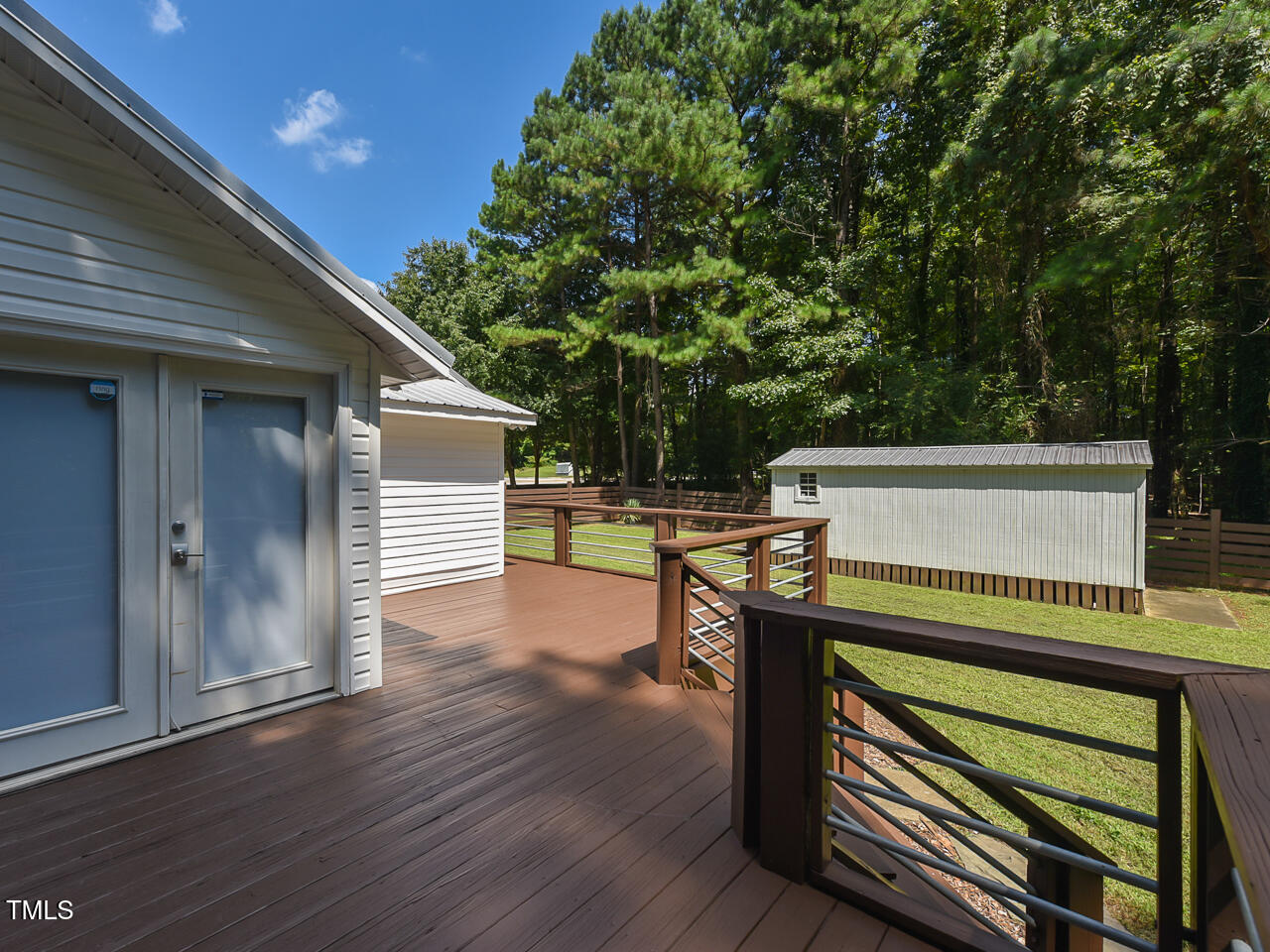 3223 Tryon Road Raleigh, NC 27603 - Photo 29 of 45 a view of a deck with wooden floor and seating space