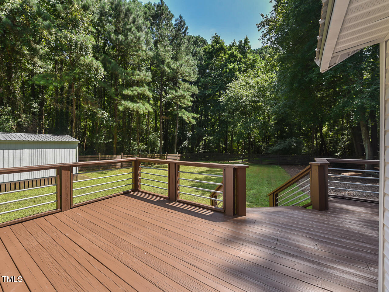 3223 Tryon Road Raleigh, NC 27603 - Photo 30 of 45 a view of outdoor space with deck and trees