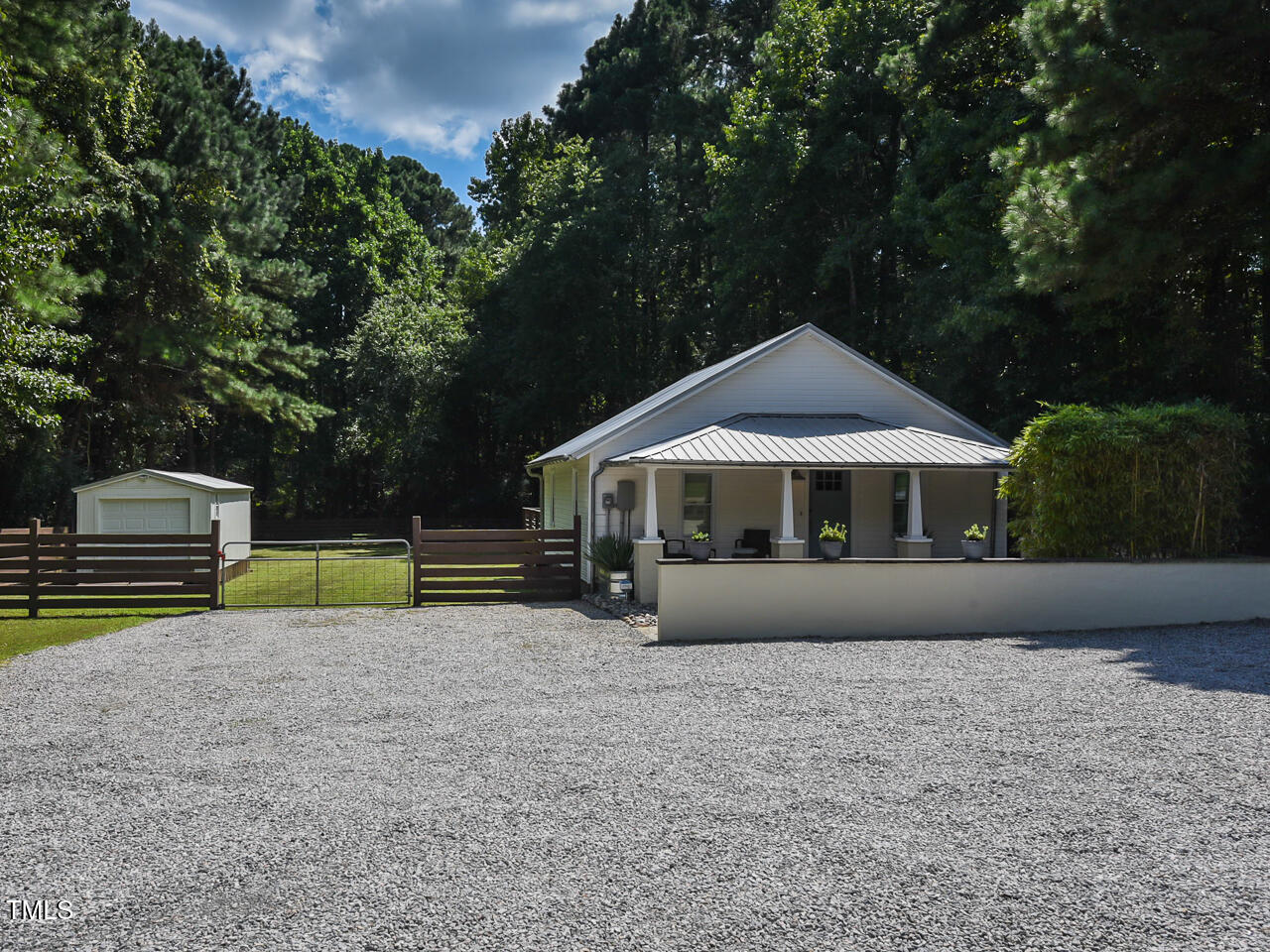 3223 Tryon Road Raleigh, NC 27603 - Photo 4 of 45 a front view of a house with garden