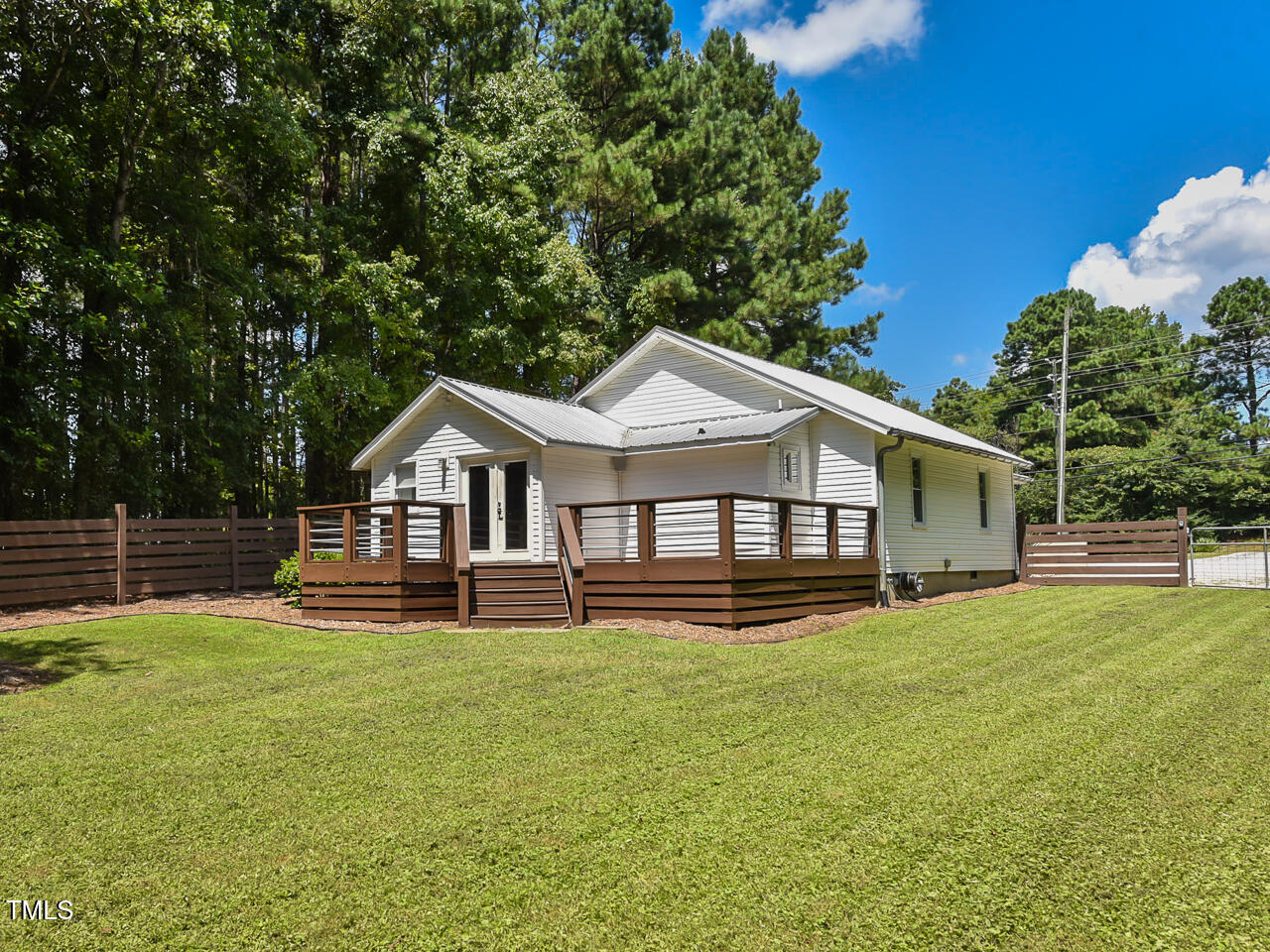3223 Tryon Road Raleigh, NC 27603 - Photo 41 of 45 a front view of house with yard and green space