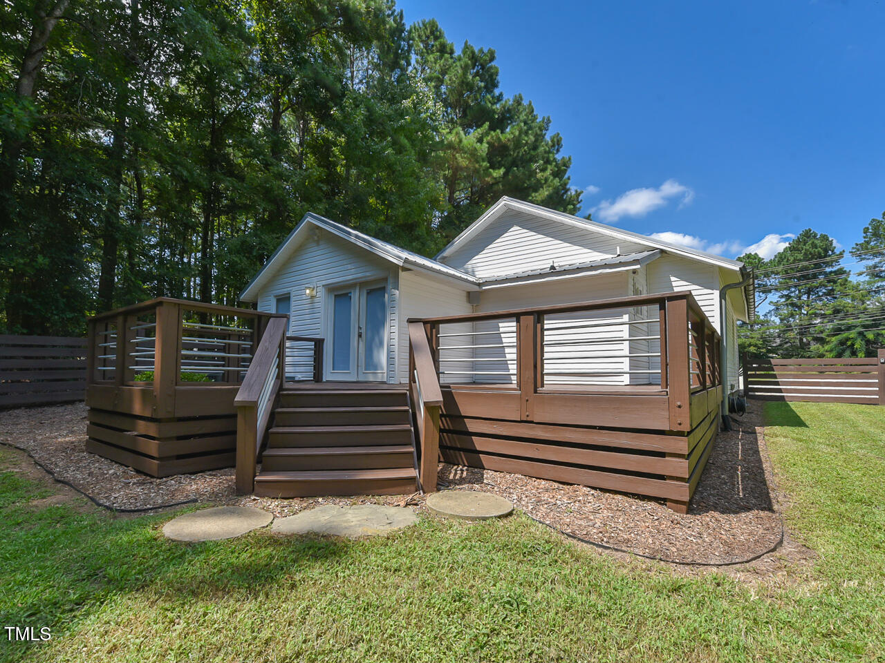 3223 Tryon Road Raleigh, NC 27603 - Photo 42 of 45 a front view of a house with garden