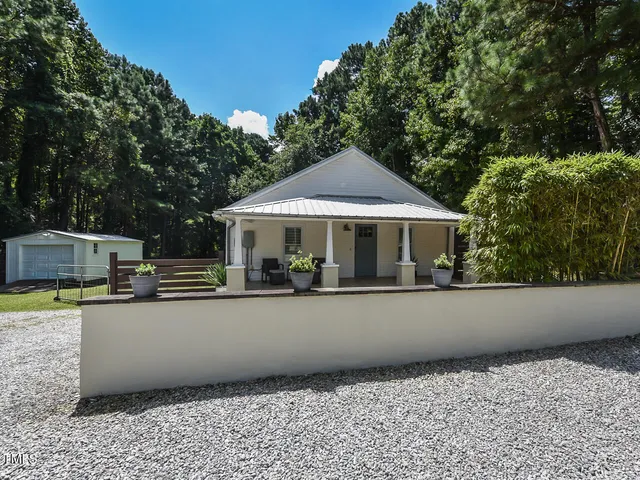 a house with trees in the background