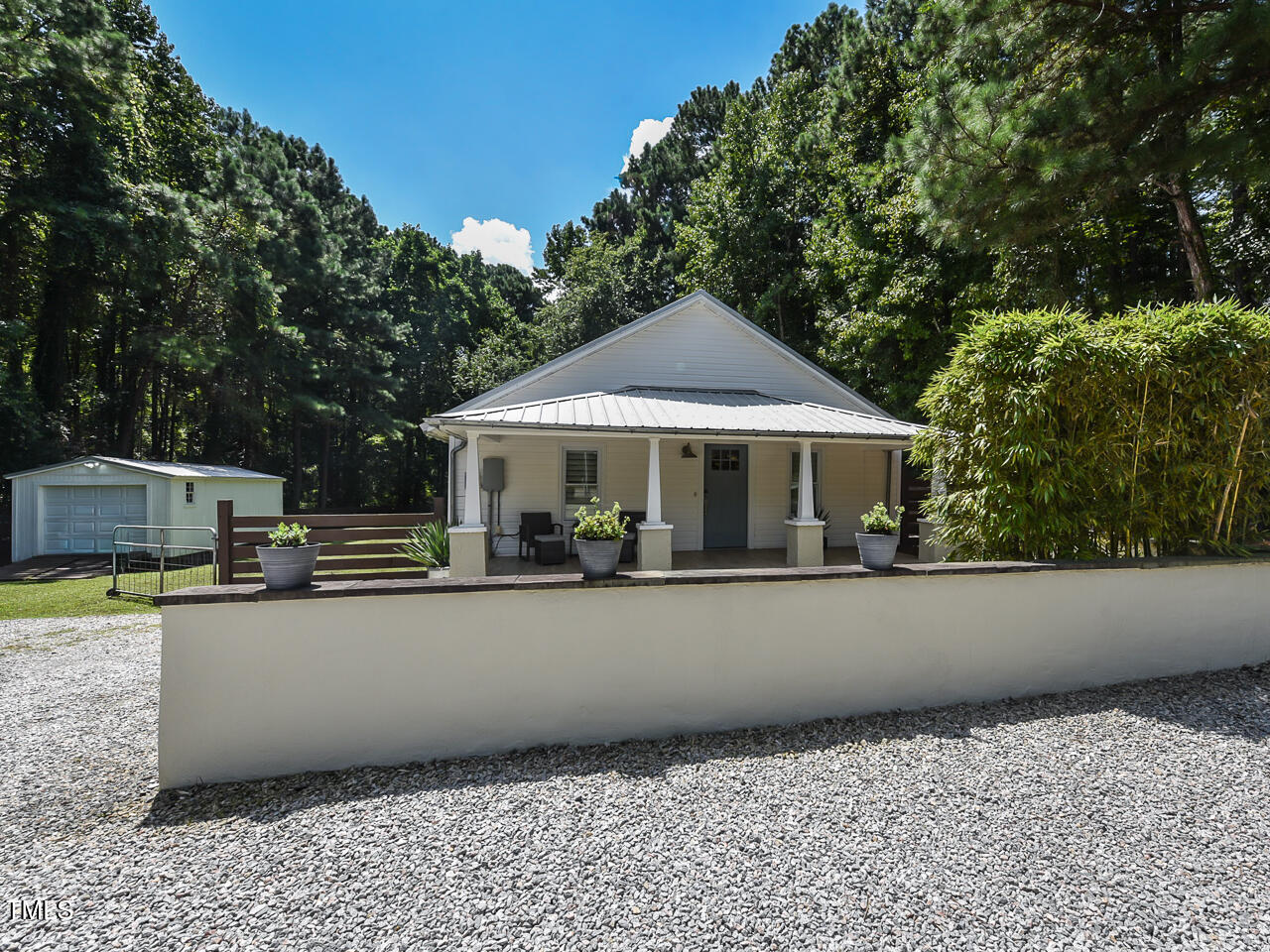 3223 Tryon Road Raleigh, NC 27603 - Photo 5 of 45 a house with trees in the background
