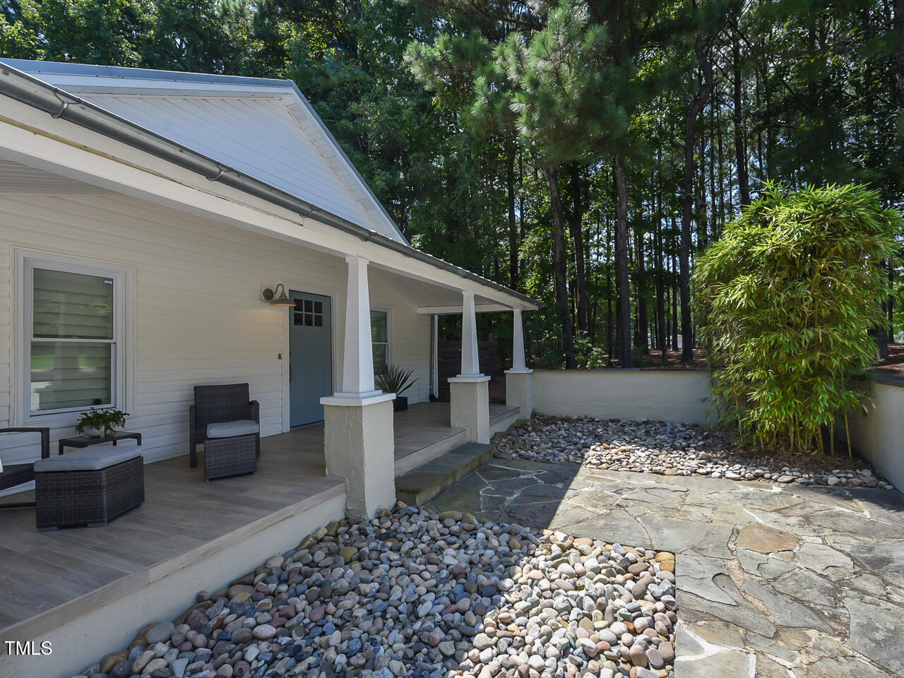 3223 Tryon Road Raleigh, NC 27603 - Photo 8 of 45 a view of a patio with couches table and chairs and potted plants