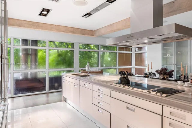 a bedroom with a bed and painting on the wall