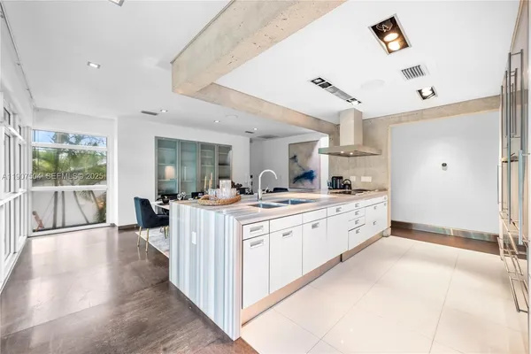 a bedroom with a bed and painting on the wall