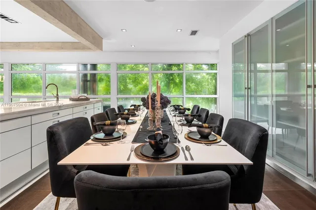 a bed room with a bed and a painting on the wall