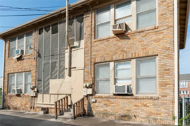 a view of a brick house with a window