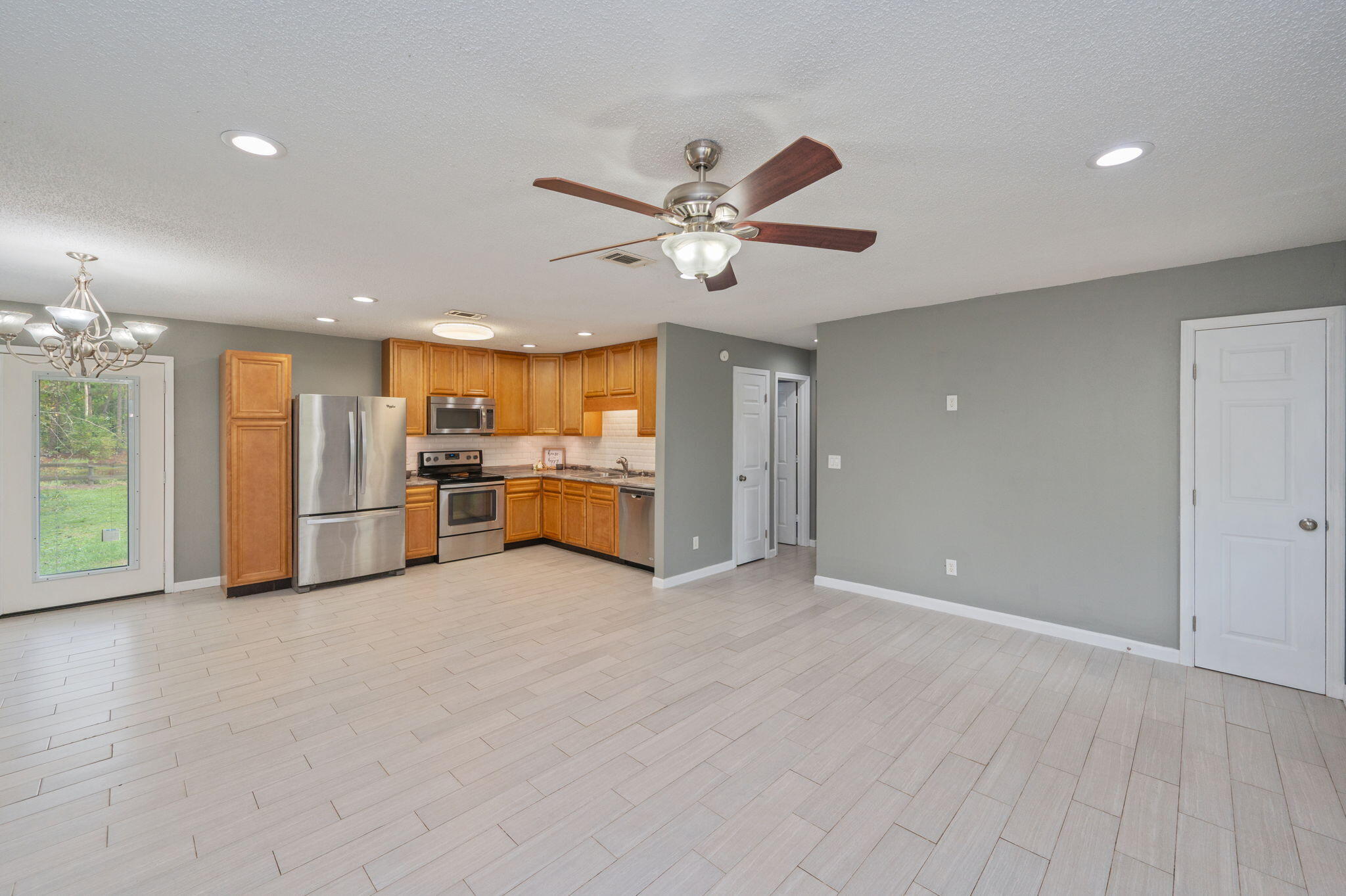 91 North Street DeFuniak Springs, FL 32433 - Photo 13 of 55 a view of a kitchen with a sink and a ceiling fan
