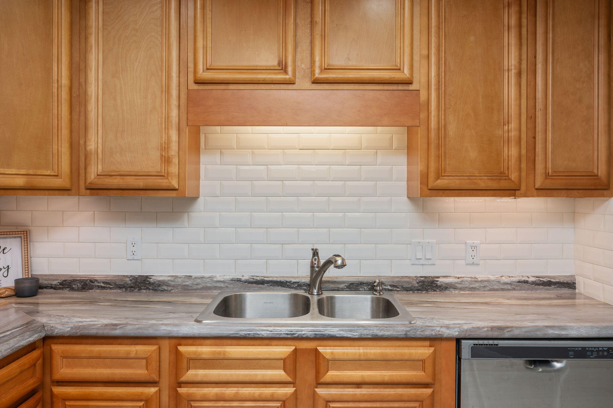 91 North Street DeFuniak Springs, FL 32433 - Photo 16 of 55 a kitchen with stainless steel appliances granite countertop a sink and cabinets