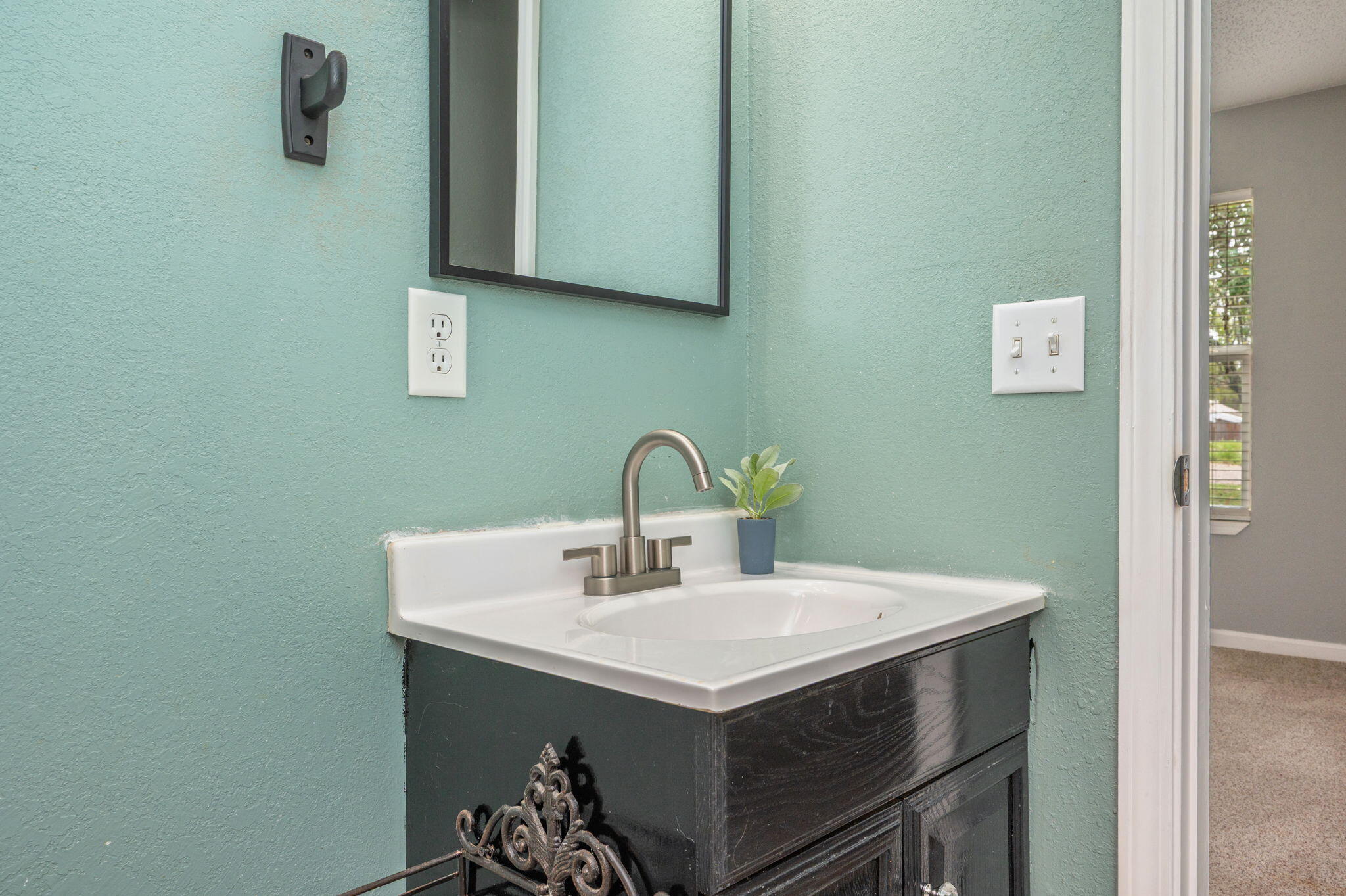 91 North Street DeFuniak Springs, FL 32433 - Photo 25 of 55 a close view of a sink and dishwasher in a bathroom