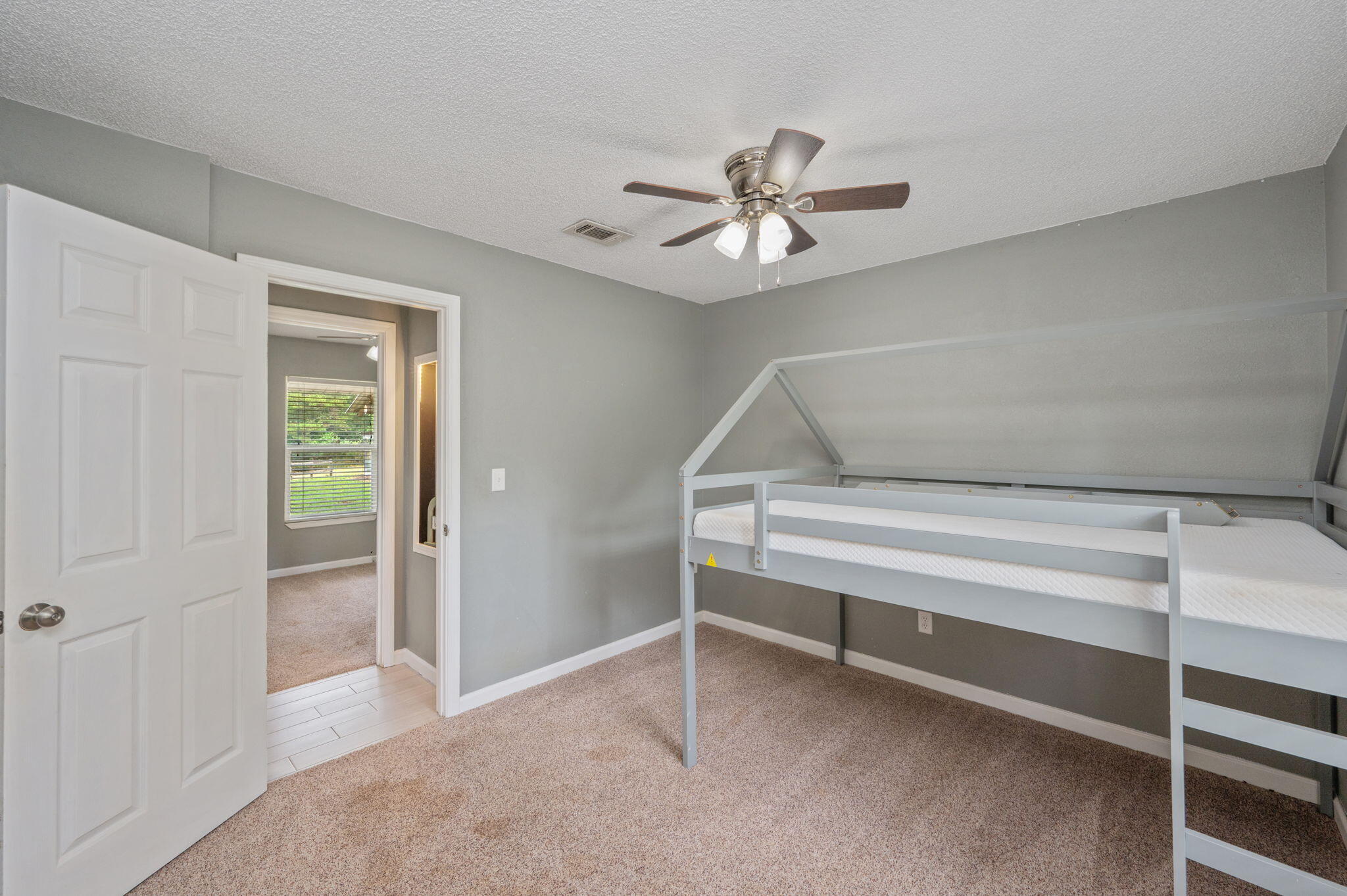91 North Street DeFuniak Springs, FL 32433 - Photo 29 of 55 a view of room with window and ceiling fan