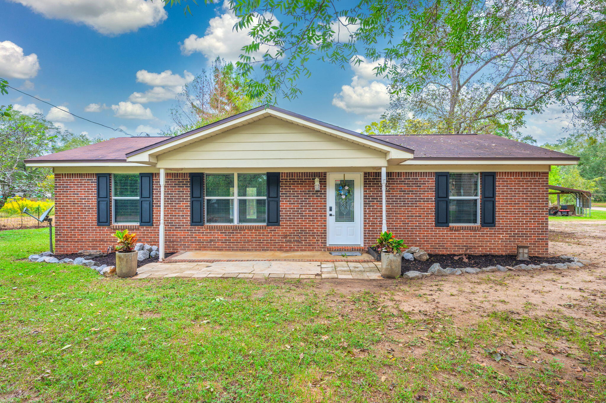 91 North Street DeFuniak Springs, FL 32433 - Photo 3 of 55 a backyard of a house with seating space