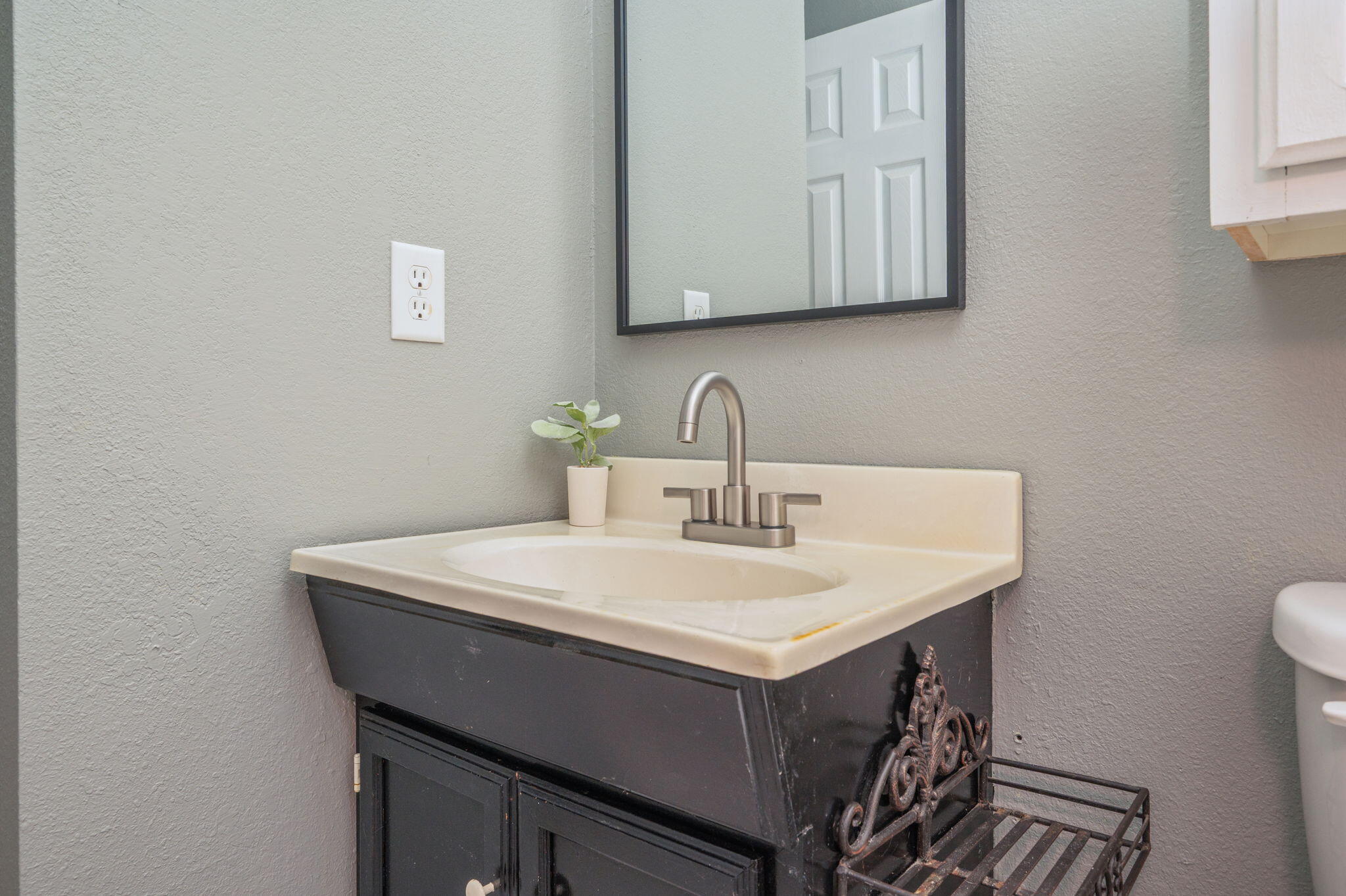 91 North Street DeFuniak Springs, FL 32433 - Photo 32 of 55 a bathroom with a sink vanity and mirror