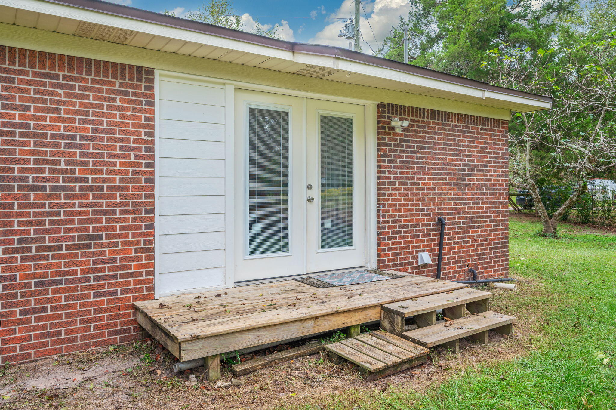 91 North Street DeFuniak Springs, FL 32433 - Photo 36 of 55 a view of a two chairs in the yard
