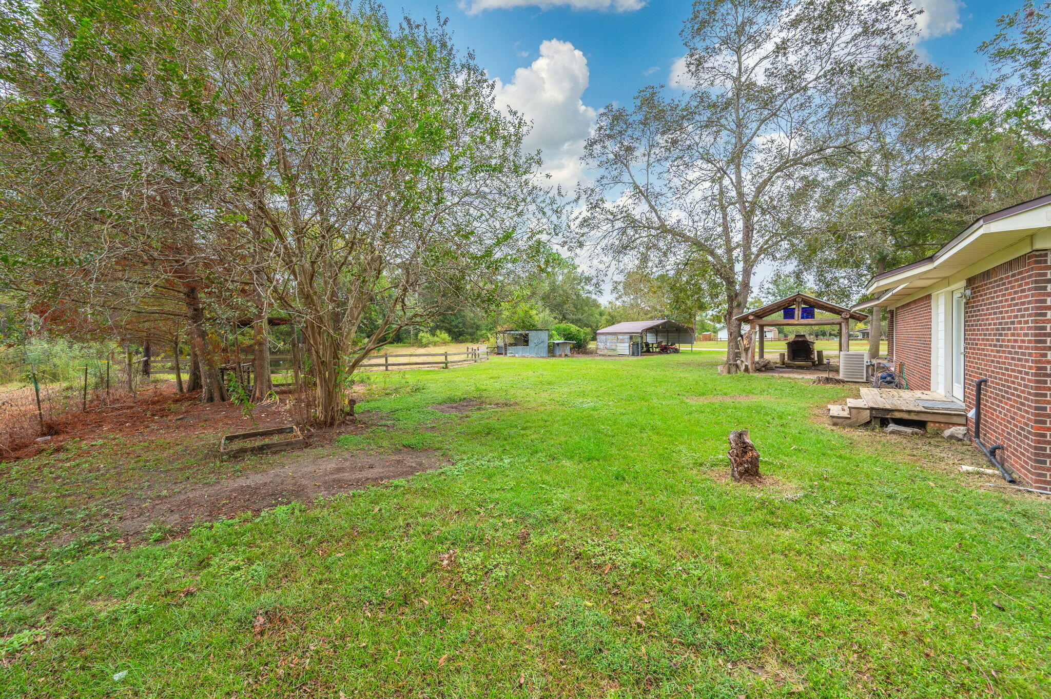 91 North Street DeFuniak Springs, FL 32433 - Photo 37 of 55 a backyard of a house with table and chairs