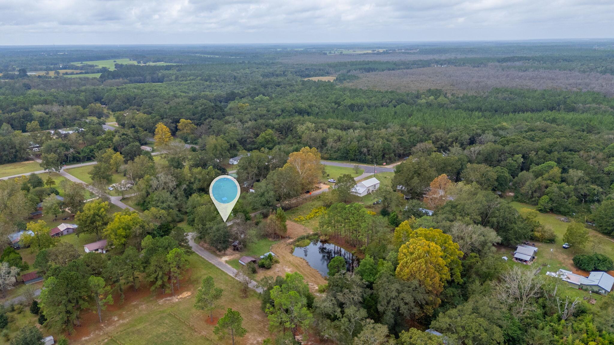 91 North Street DeFuniak Springs, FL 32433 - Photo 53 of 55 a aerial view of a golf course with a trees