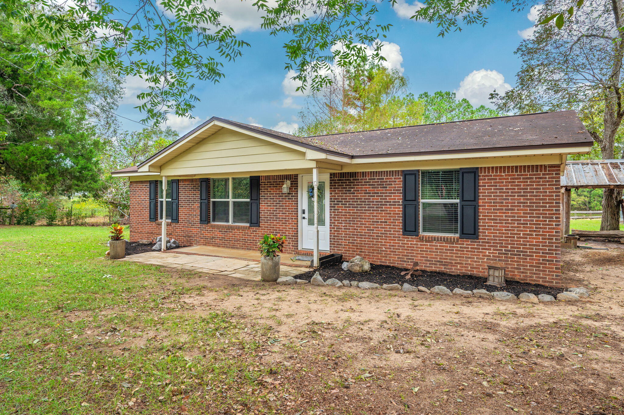 91 North Street DeFuniak Springs, FL 32433 - Photo 6 of 55 a front view of a house with garden