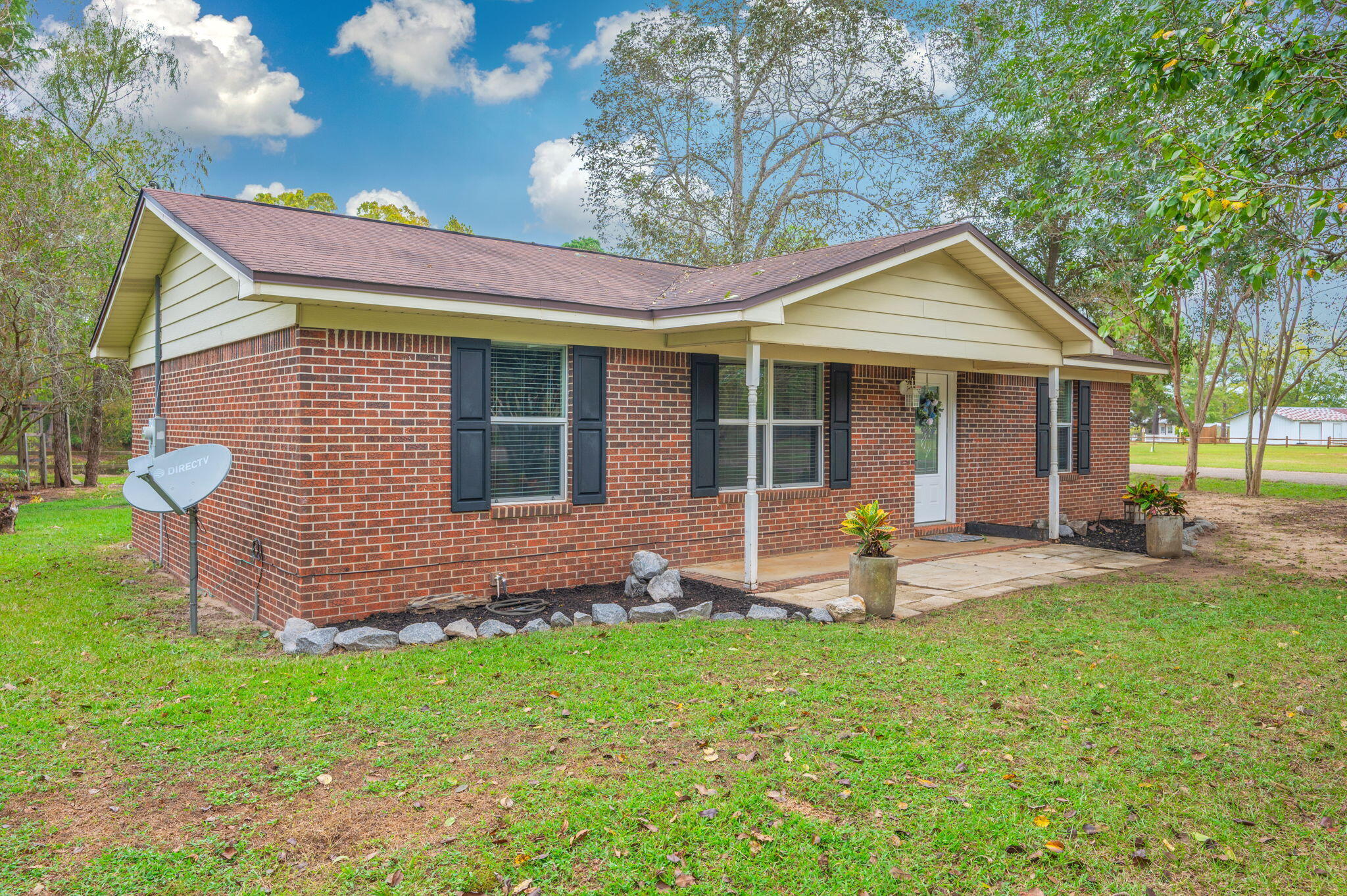 91 North Street DeFuniak Springs, FL 32433 - Photo 7 of 55 a view of a house with a yard and sitting area