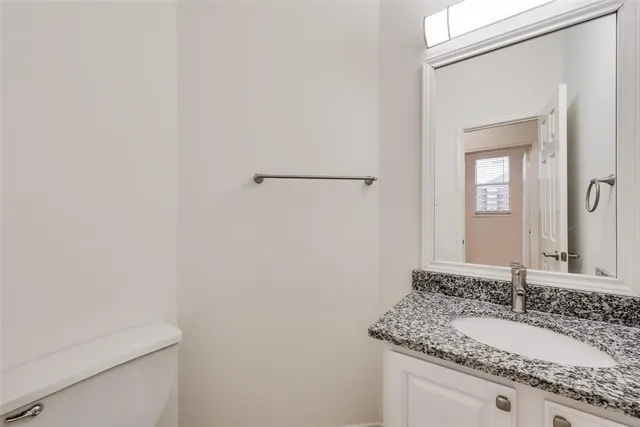 a view of a white wall with a window