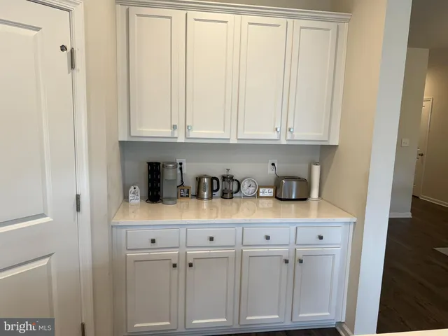 a view of cabinets and window