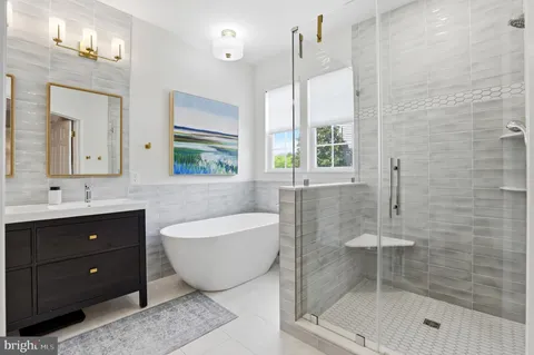 a kitchen with kitchen island granite countertop appliances cabinets a sink and a center island