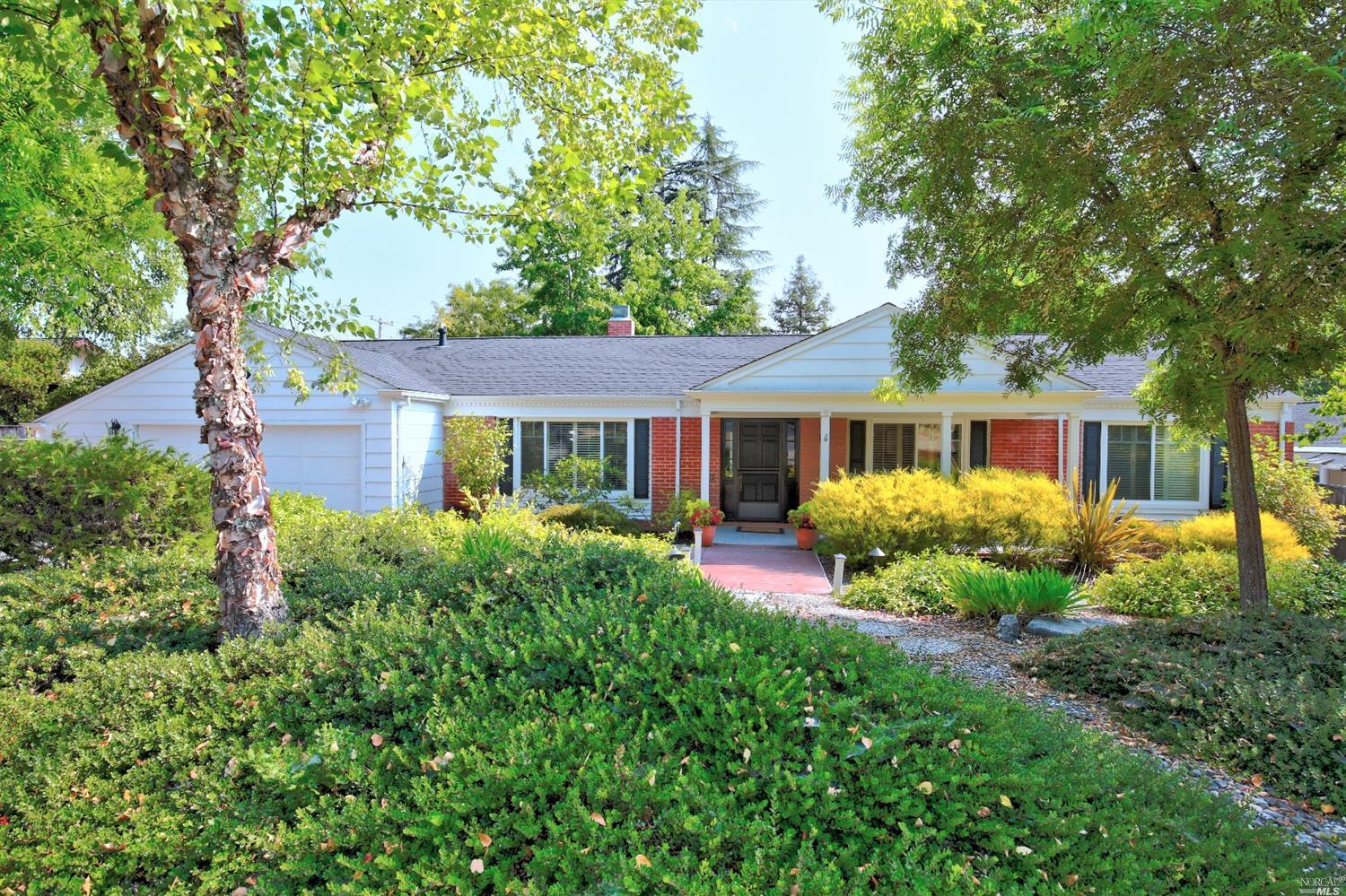 5910 Yerba Buena Road Santa Rosa, CA 95409 - Photo 1 of 1 a front view of a house with yard and green space