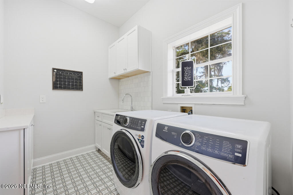 7956 Hollyridge Road Jacksonville, FL 32256 - Photo 19 of 50 a utility room with dryer and washer