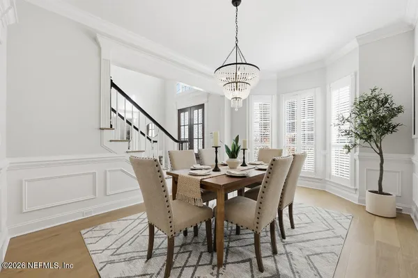 a view of a dining room with furniture window and wooden floor