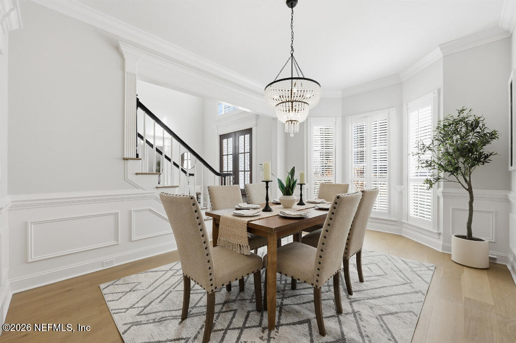 7956 Hollyridge Road Jacksonville, FL 32256 - Photo 27 of 50 a view of a dining room with furniture window and wooden floor
