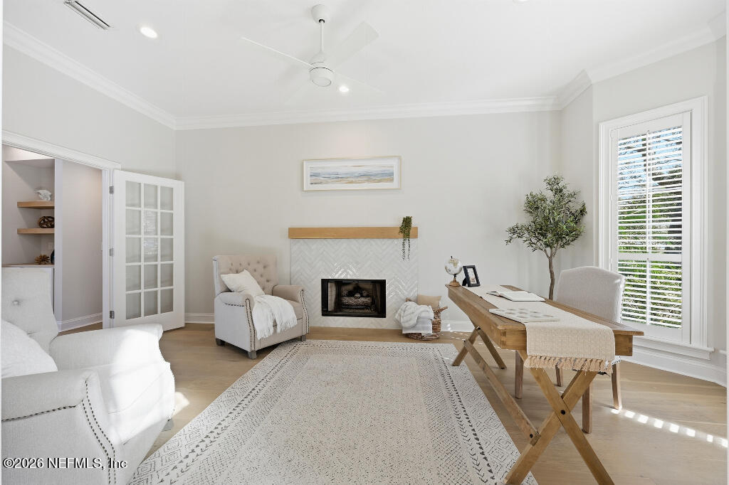 7956 Hollyridge Road Jacksonville, FL 32256 - Photo 28 of 50 a living room with furniture and a fireplace