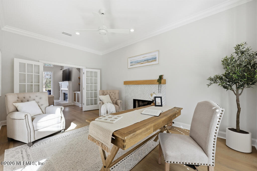 7956 Hollyridge Road Jacksonville, FL 32256 - Photo 29 of 50 a living room with furniture a table and a potted plant