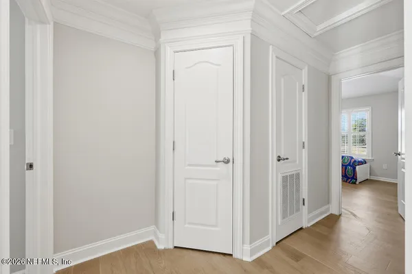 a view of an empty room and wooden floor