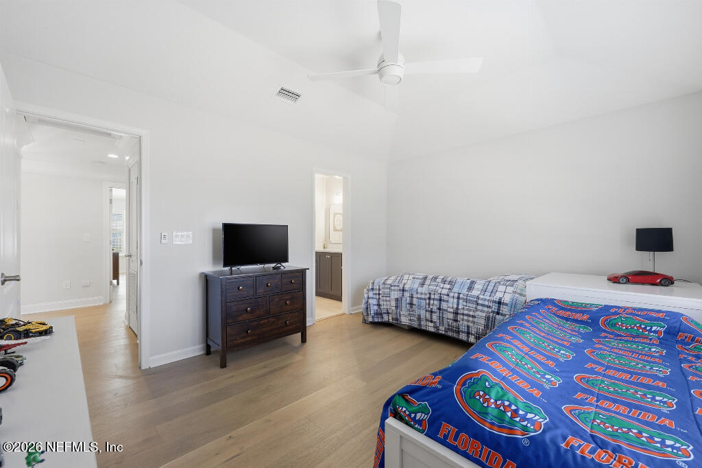 7956 Hollyridge Road Jacksonville, FL 32256 - Photo 37 of 50 a bedroom with bed and a couch