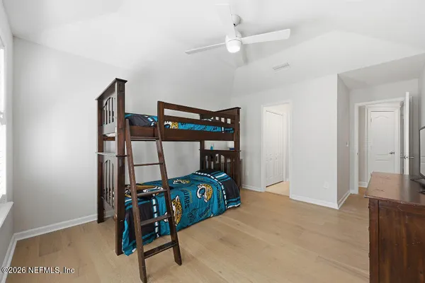 a bedroom with furniture and a bed