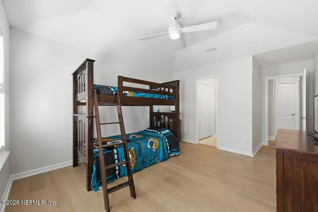 a bedroom with furniture and a bed