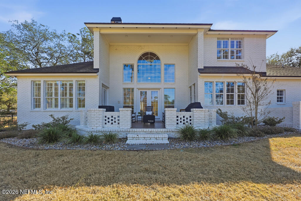 7956 Hollyridge Road Jacksonville, FL 32256 - Photo 43 of 50 front view of a house with a yard