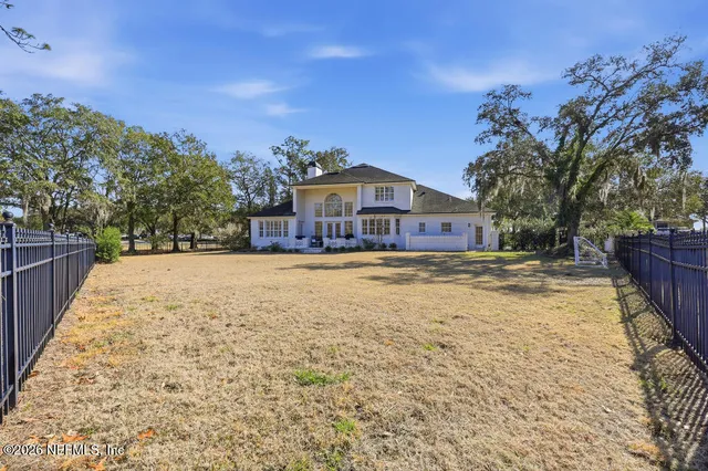 a view of swimming pool with a yard