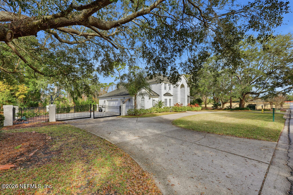 7956 Hollyridge Road Jacksonville, FL 32256 - Photo 46 of 50 a view of road and trees