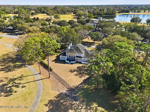 a view of residential houses with outdoor space and ocean view