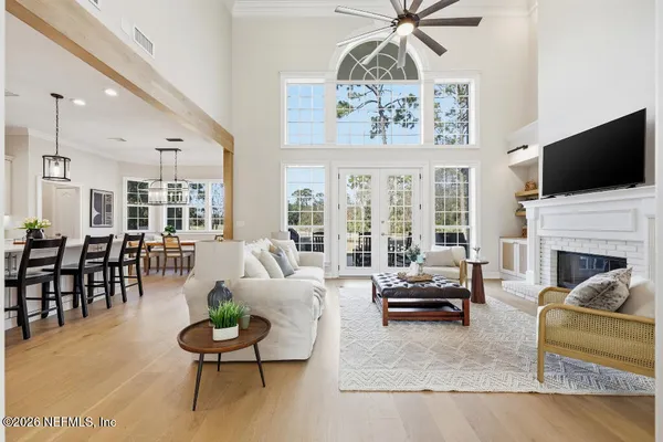 a living room with furniture fireplace and flat screen tv