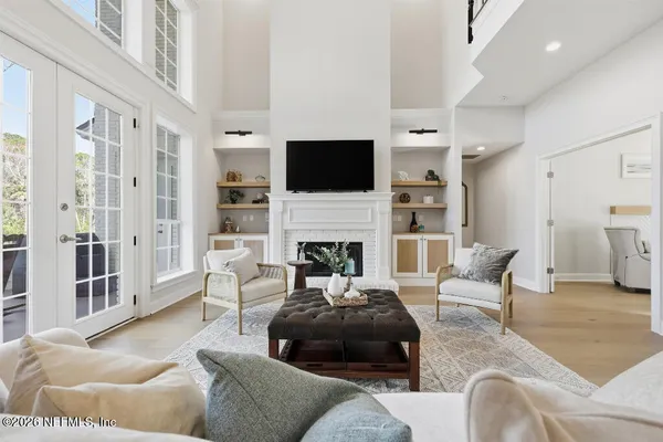 a living room with furniture fireplace and a flat screen tv