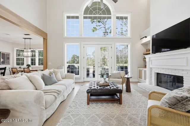 a living room with furniture fireplace and flat screen tv