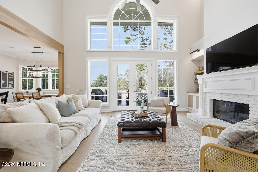 7956 Hollyridge Road Jacksonville, FL 32256 - Photo 10 of 50 a living room with furniture fireplace and flat screen tv